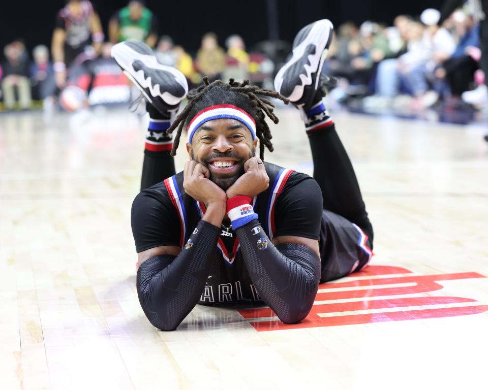 Hammer Harrison of The Harlem Globetrotters interrupts the game for an impromptu photo shoot during their game with the Washington Generals at Wells Fargo Arena in Des Moines, Iowa.