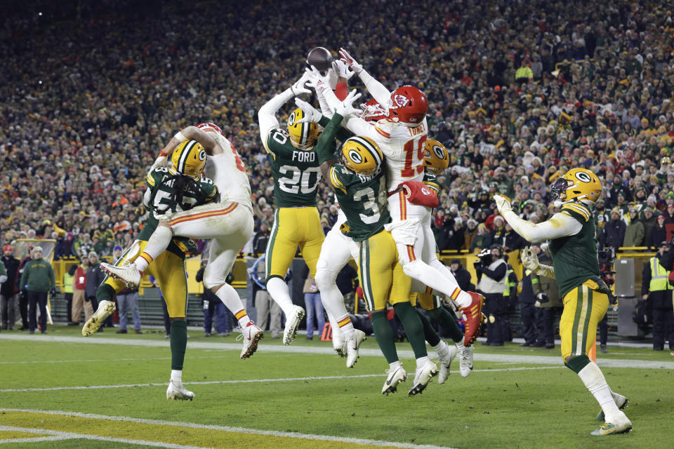 A Kansas City Chiefs quarterback Patrick Mahomes pass is defended by the Green Bay Packers in the end zone during the second half of an NFL football game Sunday, Dec. 3, 2023 in Green Bay, Wis. (AP Photo/Mike Roemer)
