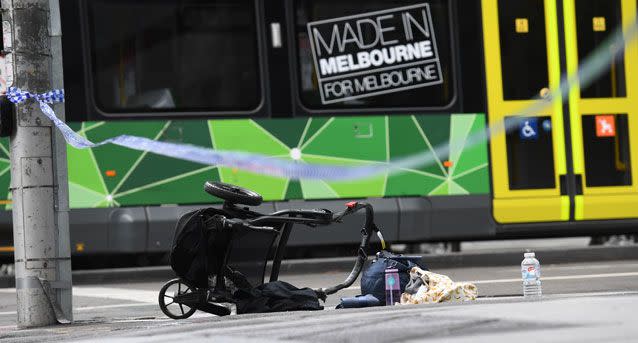 A pram is seen on the corner of Bourke and William Street following Friday's rampage. Source: AAP