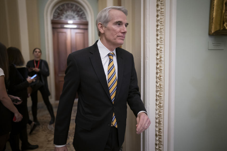 FILE - In this Jan. 31, 2020, file photo Sen. Rob Portman, R-Ohio, arrives as the first impeachment trial of President Donald Trump in Washington. Portman said Monday, Jan. 25, 2021, that he won't seek reelection and plans to end a career in federal government spanning more than three decades. (AP Photo/J. Scott Applewhite, File)