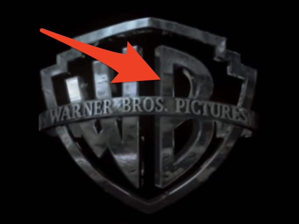 arrow pointing to reflection of a snake in the warner bros logo at the start of harry potter and the goblet of fire