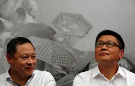 FILE PHOTO: Professors Benny Tai (L) and Chan Kin-man, founders of Occupy Central civil disobedience movement, take part in the second anniversary of the movement outside the government headquarters in Hong Kong, China September 28, 2016.  REUTERS/Bobby Yip