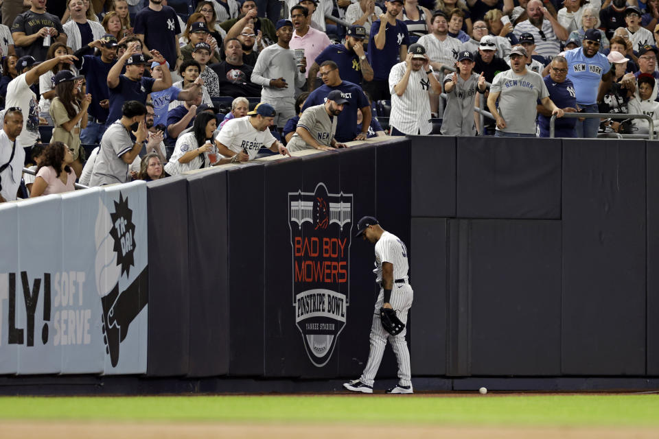 New York Yankees left fielder Aaron Hicks reacts after missing a catch on a RBI double hit by Tampa Bay Rays' Wander Franco during the fourth inning of a baseball game Friday, Sept. 9, 2022, in New York. (AP Photo/Adam Hunger)