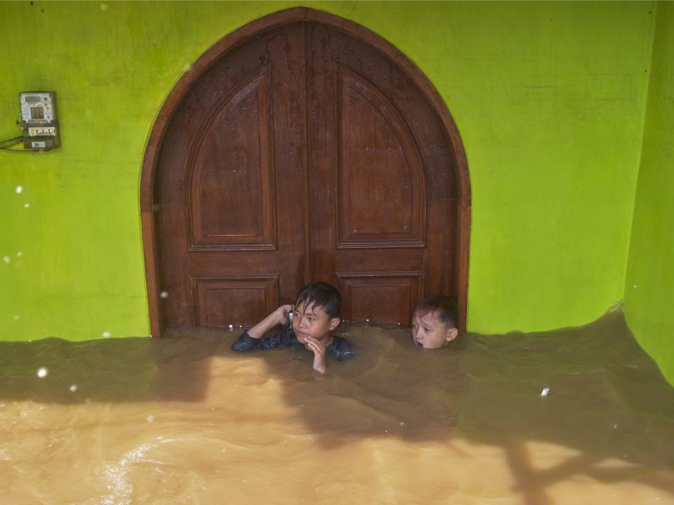 Boy in Jakarta floods