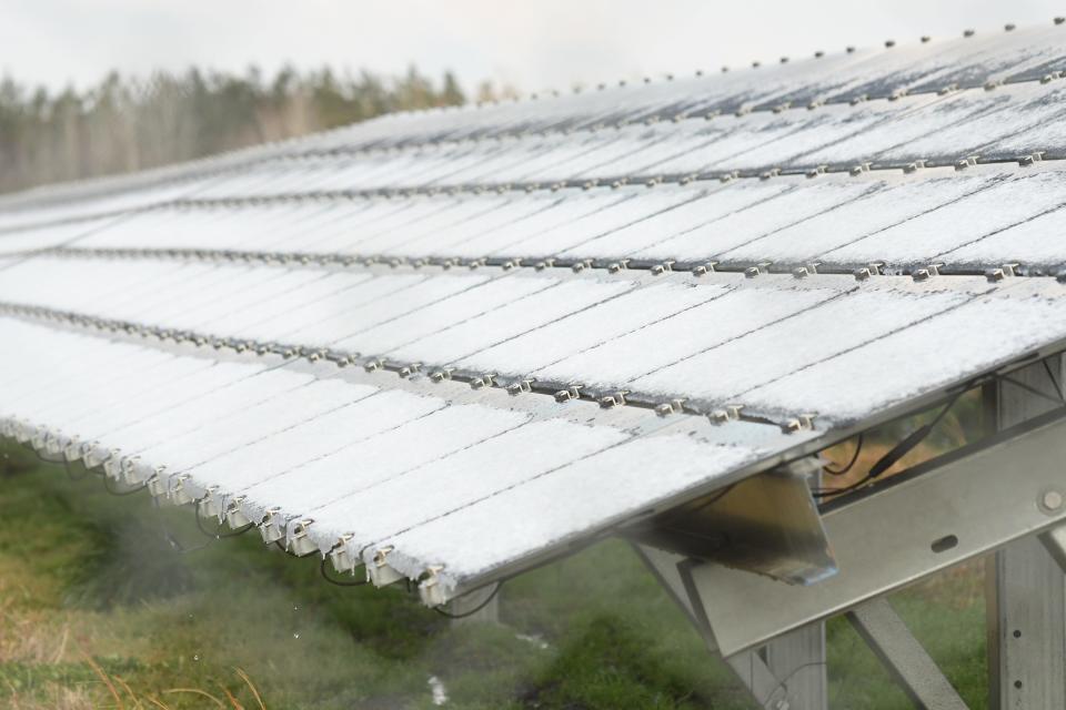 Solar pannels at the Bearford Soalar Farm off Hwy 117 in Burgaw, N.C. are covered with a light dusting of snow early Friday Feb. 21, 2020. [KEN BLEVINS/STARNEWS]