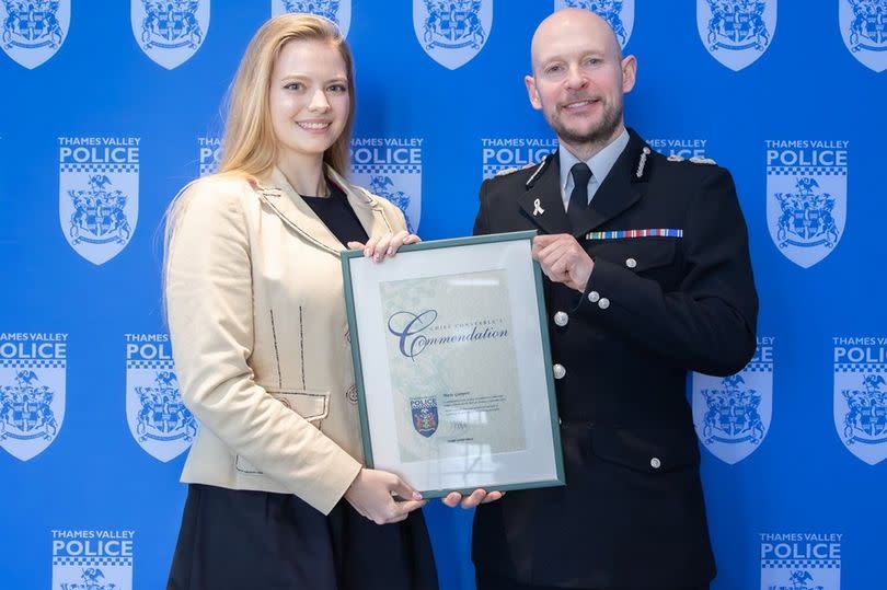 Marie Gumpert was presented with a commendation by Chief Constable Jason Hogg after she 'saved' the passengers on board -Credit:Thames Valley Police