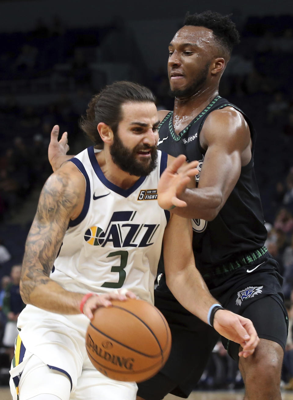 Utah Jazz's Ricky Rubio, left, of Spain, drives as Minnesota Timberwolves' Josh Okogie, of Nigeria, defends during the first half of an NBA basketball game Wednesday, Oct. 31, 2018, in Minneapolis. (AP Photo/Jim Mone)