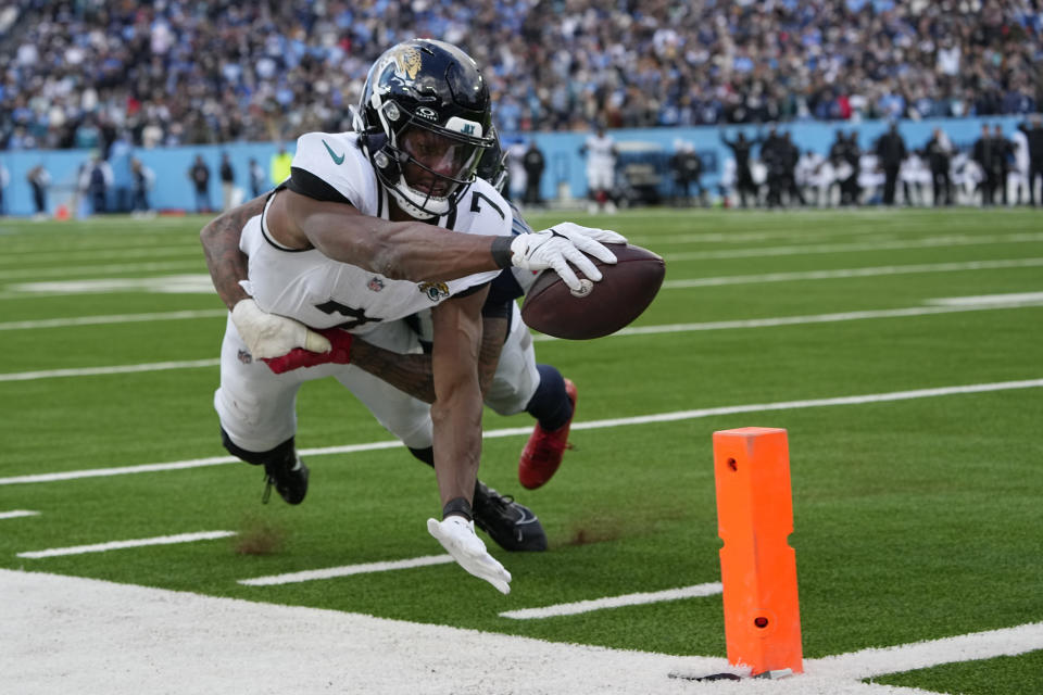 Jacksonville Jaguars wide receiver Zay Jones (7) is stopped short of the goal line by Tennessee Titans cornerback Sean Murphy-Bunting (0) during the second half of an NFL football game Sunday, Jan. 7, 2024, in Nashville, Tenn. (AP Photo/George Walker IV)