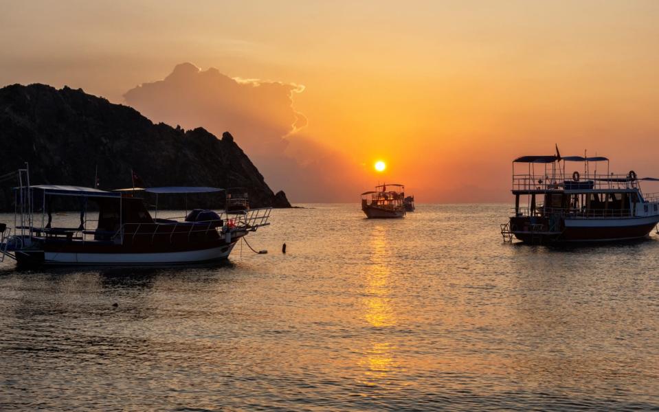 Gulet boats at sunset in the village of Cirali along the Lycian coast - Getty Images/iStockphoto 