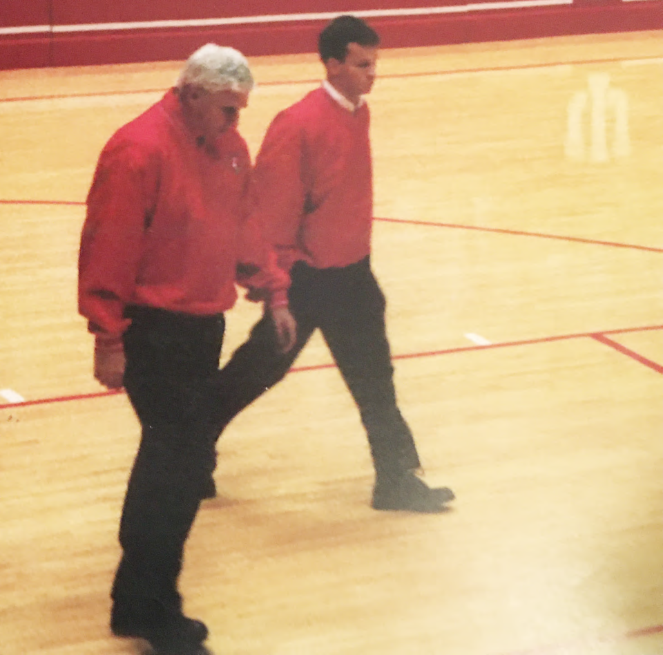 Coach Bob Knight walks out from the dressing room in Assembly Hall for the last time, unbeknownst to him and everyone else, on Senior Night on Feb. 29, 2000, when IU played Purdue. Matthew Babrick, manager for the men's basketball team, is walking Coach Knight out to welcome Coach Keating.