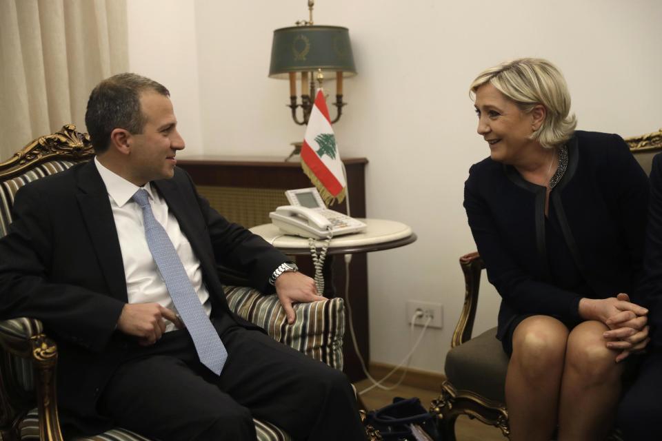 Lebanese Foreign Minister Gibran Bassil, left, meets with far-right French leader and presidential candidate Marine Le Pen, right, in Beirut, Lebanon, Monday, Feb. 20, 2017. Le Pen has arrived in Beirut to meet with the Lebanese head of state and leading Christian figures. The National Front leader is hoping to burnish her credentials as a defender of Christians in the Middle East, ahead of France's April 23 presidential elections. (AP Photo/Hussein Malla)