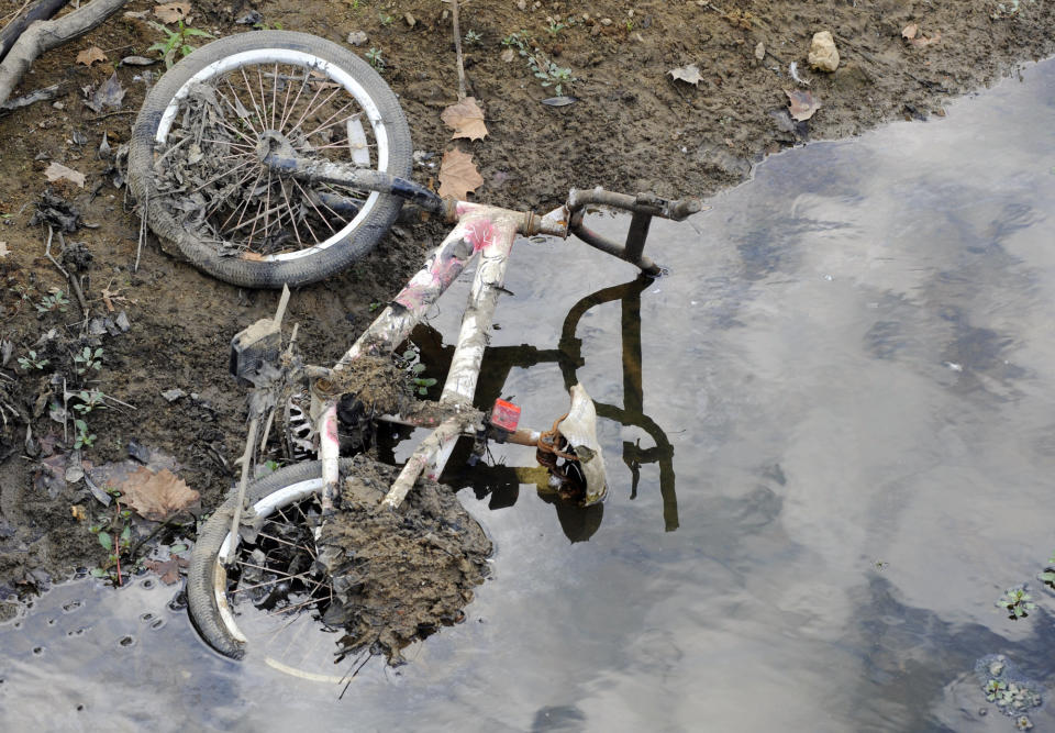 A bicycle that was submerged in a pond lies on a dried-up bank in Helena, Ala., on Thursday, Sept. 26, 2019. Weeks of dry, hot weather have plunged the Deep South further into a drought that a federal assessment says is affecting more than 11 million people and threatening crops across a five-state region. (AP Photo/Jay Reeves)