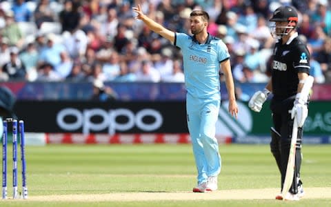 Kane Williamson of New Zealand looks on as Mark Wood appeals successfully on review for a run out whilst Kane was backing up - Credit: Michael Steele/Getty Images