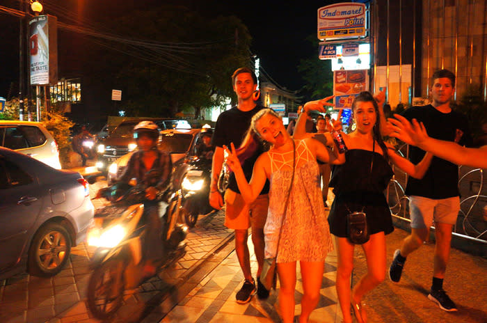 Ready to party: Revelers coming to Legian to enjoy their summer break. Most of them disregards the under-age drinking restrictions. (