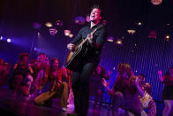 This image released by O&M/DKC shows Will Swenson as Neil Diamond during a performance of the musical “A Beautiful Noise." (Julieta Cervantes/O&M/DKC via AP)