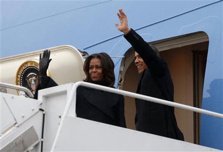 U.S. President Barack Obama and first lady Michelle Obama depart Joint Base Andrews in Washington en route to Johannesburg December 9, 2013. REUTERS/Kevin Lamarque