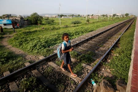 The Wider Image: The Indian children who take a train to collect water