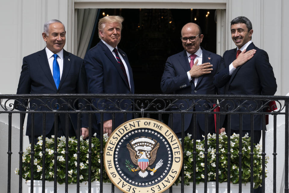 FILE - In this Tuesday, Sept. 15, 2020 file photo, Israeli Prime Minister Benjamin Netanyahu, left, President Donald Trump, Bahrain Foreign Minister Khalid bin Ahmed Al Khalifa and United Arab Emirates Foreign Minister Abdullah bin Zayed al-Nahyan react on the Blue Room Balcony after signing the Abraham Accords during a ceremony on the South Lawn of the White House in Washington. Jewish American voters have leaned Democratic for decades, but the GOP is still eyeing modest gains with the constituency in states where President Donald Trump could reap major benefits with even small improvements over his performance in 2016. (AP Photo/Alex Brandon)