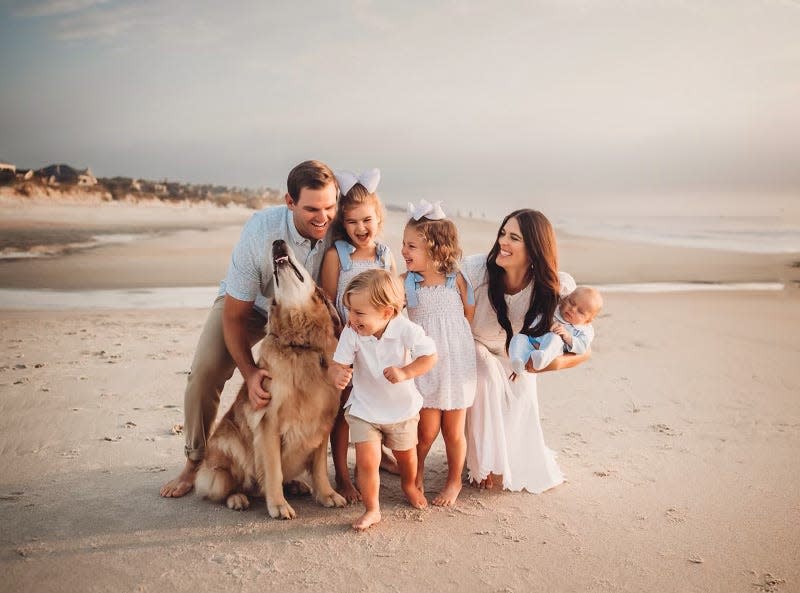 Jaguars offensive coordinator Press Taylor at Ponte Vedra Beach with his family. Wife Brooklyn is holding 3-month-old son Billy, with daughters Teale and Carolina Leigh, son Woods and golden retriever dog Bronx.