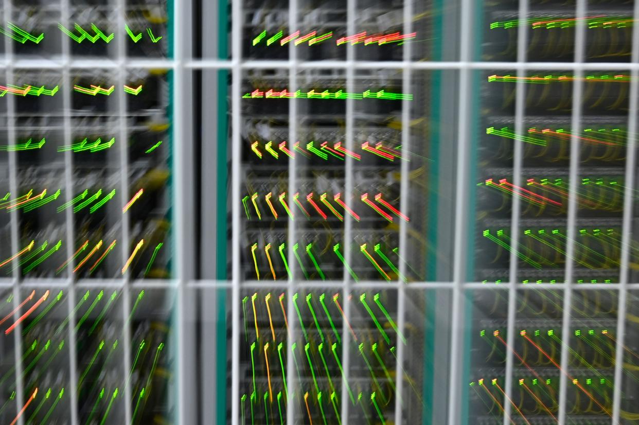 A picture taken in 2020 shows a zooming effect of LEDs on network infrastructure at the datacenter of French mobile communications company SFR in Cesson-sevigne, in the suburbs of Rennes, western France.