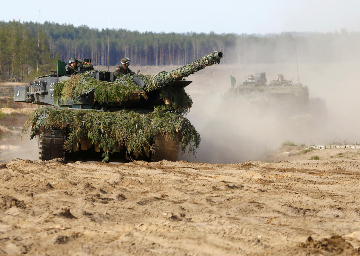 German army battle tanks Leopard 2 return after a NATO exercise at the Pabradė military training field in Lithuania in 2017. 