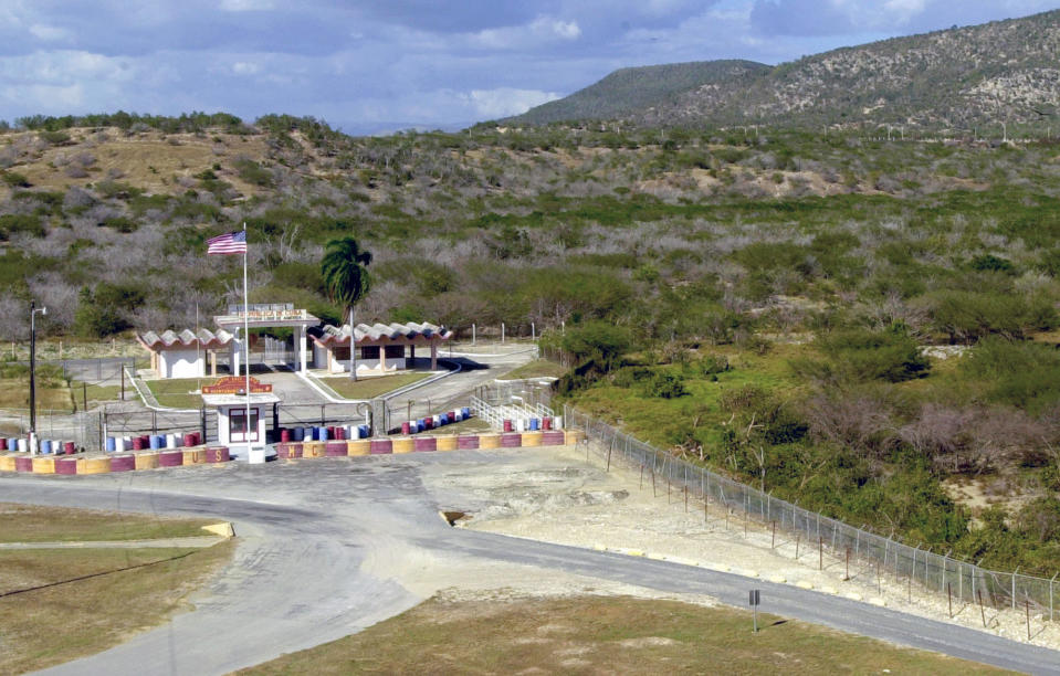 FILE - This Feb. 4, 2002, file photo show the northeast gate on the border of Cuba at the U.S. Naval Base at Guantanamo Bay, Cuba. This post at the northeast gate of the border is about 2 miles from Camp X-Ray where al-Qaida and Taliban detainees from Afghanistan were held. The White House says it intends to shutter the prison on the U.S. base in Cuba, which opened in January 2002 and where most of the 39 men still held have never been charged with a crime. (AP Photo/Lynne Sladky, File)