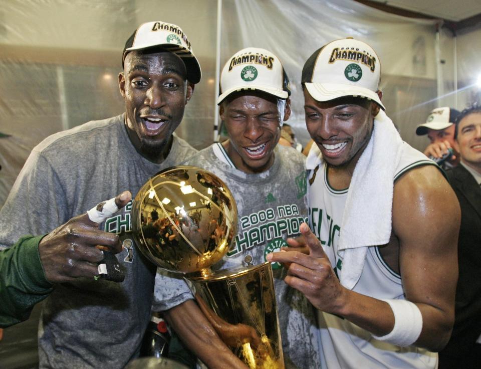 Boston Celtics, from left, Kevin Garnett, Ray Allen, and Paul Pierce celebrate in the locker room after defeating the Los Angeles Lakers to win the 2008 NBA basketball championship.