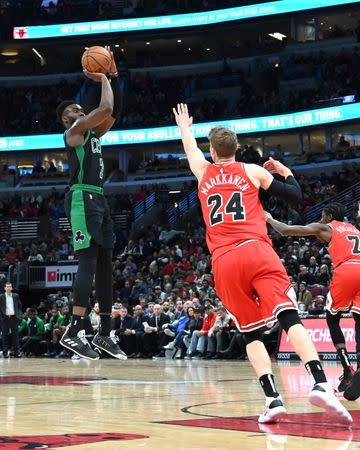 Dec 8, 2018; Chicago, IL, USA; Boston Celtics forward Jaylen Brown (7) goes up for a shot against Chicago Bulls forward Lauri Markkanen (24) during the first half at United Center. Patrick Gorski-USA TODAY Sports