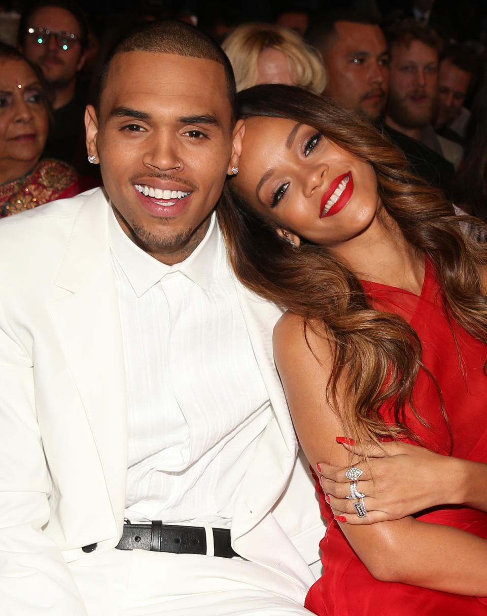 Rihanna and Chris Brown attend the Grammy Awards in 2013. (Photo: Getty Images)