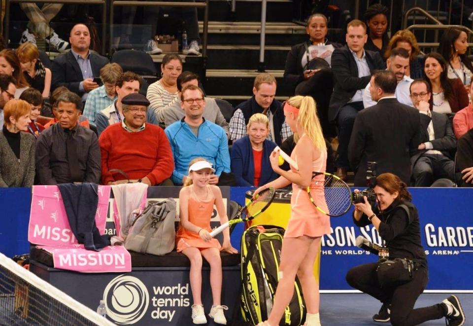 Richwoods High School No. 1 singles player Julia Wojtowicz, at age 10, on the court with world-ranked tennis star Caroline Wozniacki at Madison Square Garden in March of 2016.