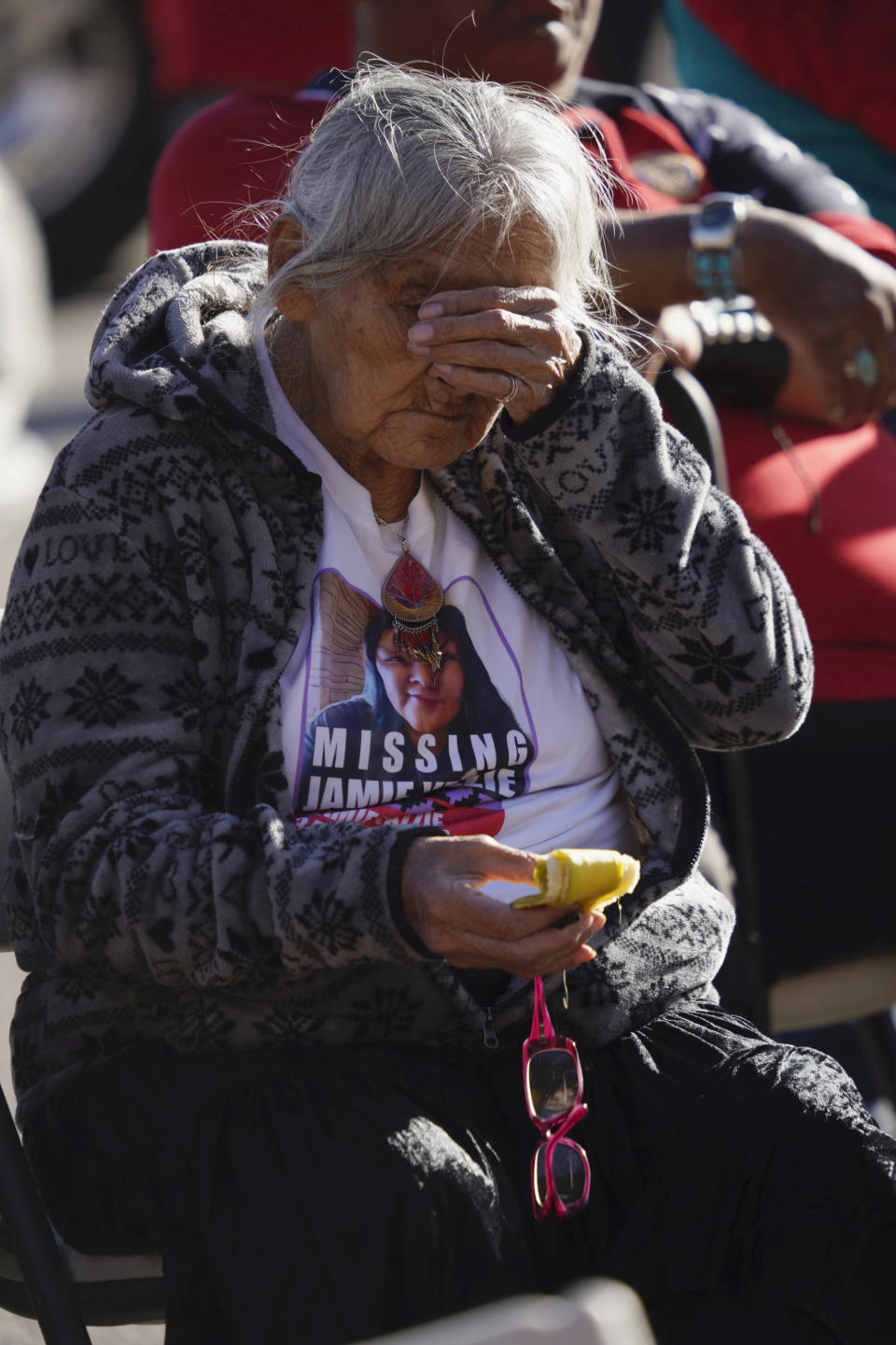 Mary K. Yazzie, the grandmother of Jamie Yazzie, who went missing in 2019, wipes her eyes during a Missing Murdered Indigenous Women Honor and Remembrance Walk on Friday, May 5, 2023, in Window Rock, Ariz. Friday marked the annual Missing and Murdered Indigenous Peoples Awareness Day, as families across the U.S. and in Canada held marches, ceremonies and vigils in honor of loved ones who either have gone missing or have been killed. (Donovan Quintero/Navajo Nation Office of the President and Vice President via AP)