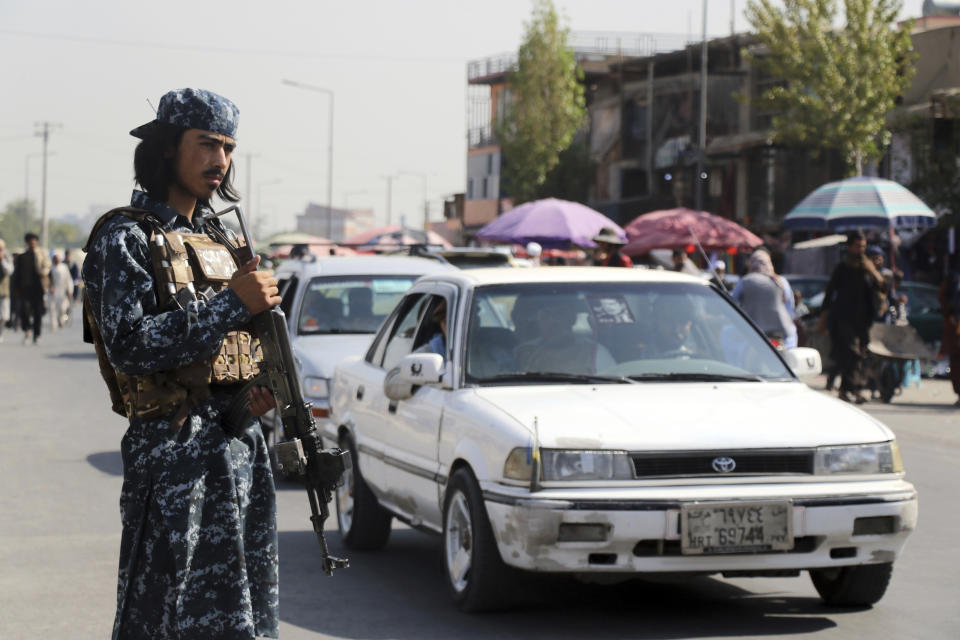 Taliban fighter stand guards in the city of Kabul, Afghanistan, Saturday, Sept. 4, 2021. (AP Photo/Wali Sabawoon)