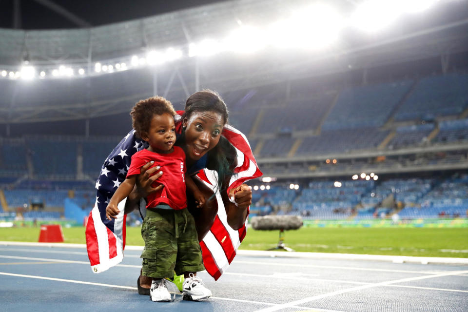 <p>Nia Ali of the United States celebrates with son Titus after winning the silver medal in the women’s 100-meter hurdles final.</p>