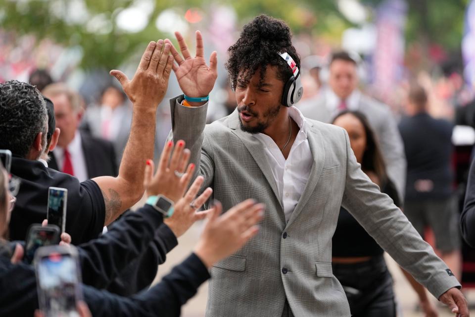 Linebacker Steele Chambers greets fans on his way into Ohio Stadium before a game.