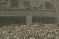 <p>A destroyed Brooks Brothers store near Ground Zero on Sept. 11, 2001. (Photo: Mark Lennihan/AP) </p>