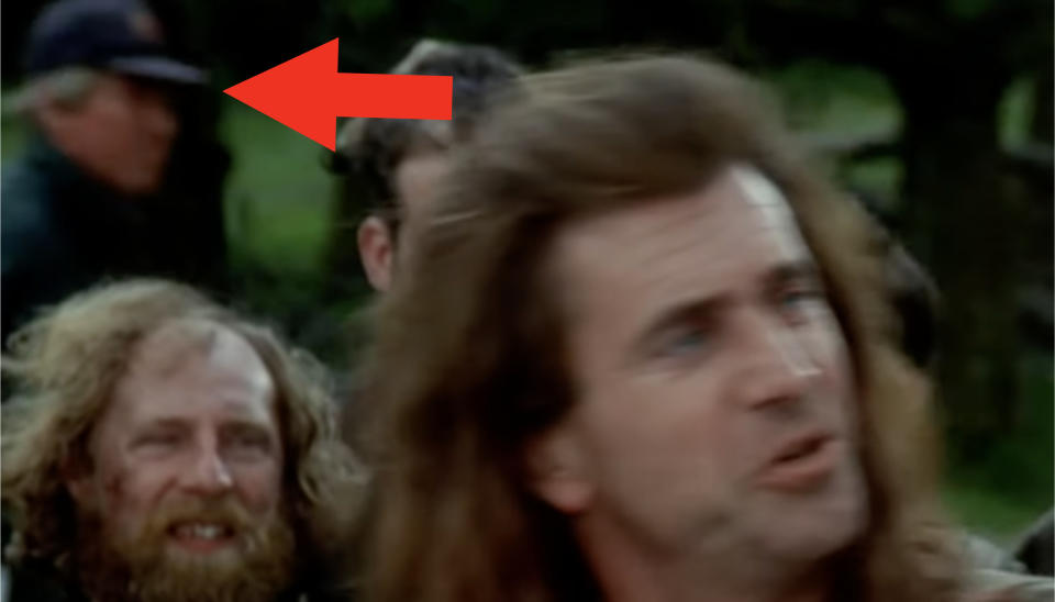 A closer shot of the man in a baseball cap in a "Braveheart" scene