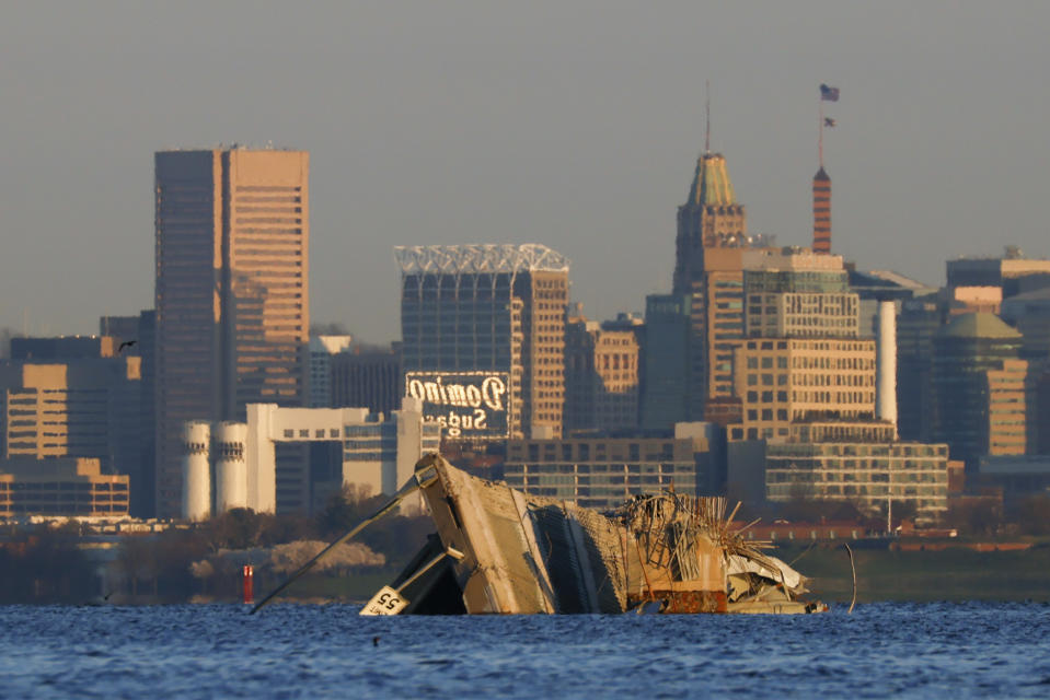 The collapsed Francis Scott Key Bridge rests in the Patapsco River, Saturday, March 30, 2024, in Baltimore. (AP Photo/Julia Nikhinson)