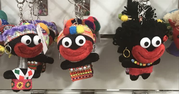 A shop has sparked a social media storm by selling keyrings that look like Golliwogs