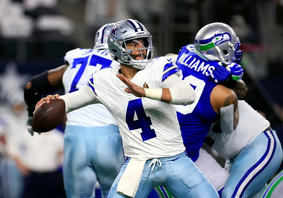 ARLINGTON, TEXAS - NOVEMBER 30: Quarterback Dak Prescott #4 of the Dallas Cowboys looks to pass during the 1st quarter of the game against the Seattle Seahawks at AT&T Stadium on November 30, 2023 in Arlington, Texas. (Photo by Ron Jenkins/Getty Images)