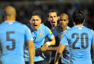 Uruguay's Diego Rolan (2nd R) celebrates with teammates Alvaro Gonzalez (20), Diego Godin (C), Jose Maria Gimenez (2) and Carlos Sanchez (5) after scoring against Colombia during their 2018 World Cup qualifying soccer match at the Centenario stadium in Montevideo, Uruguay, October 13, 2015. REUTERS/Carlos Pazos