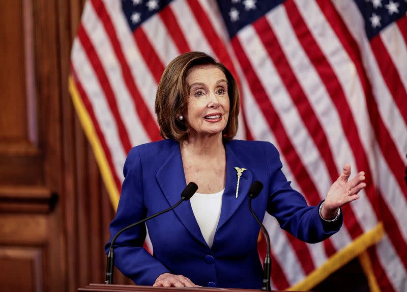 FILE PHOTO: House Speaker Pelosi holds coronavirus aid bill signing ceremony at the U.S. Capitol in Washington