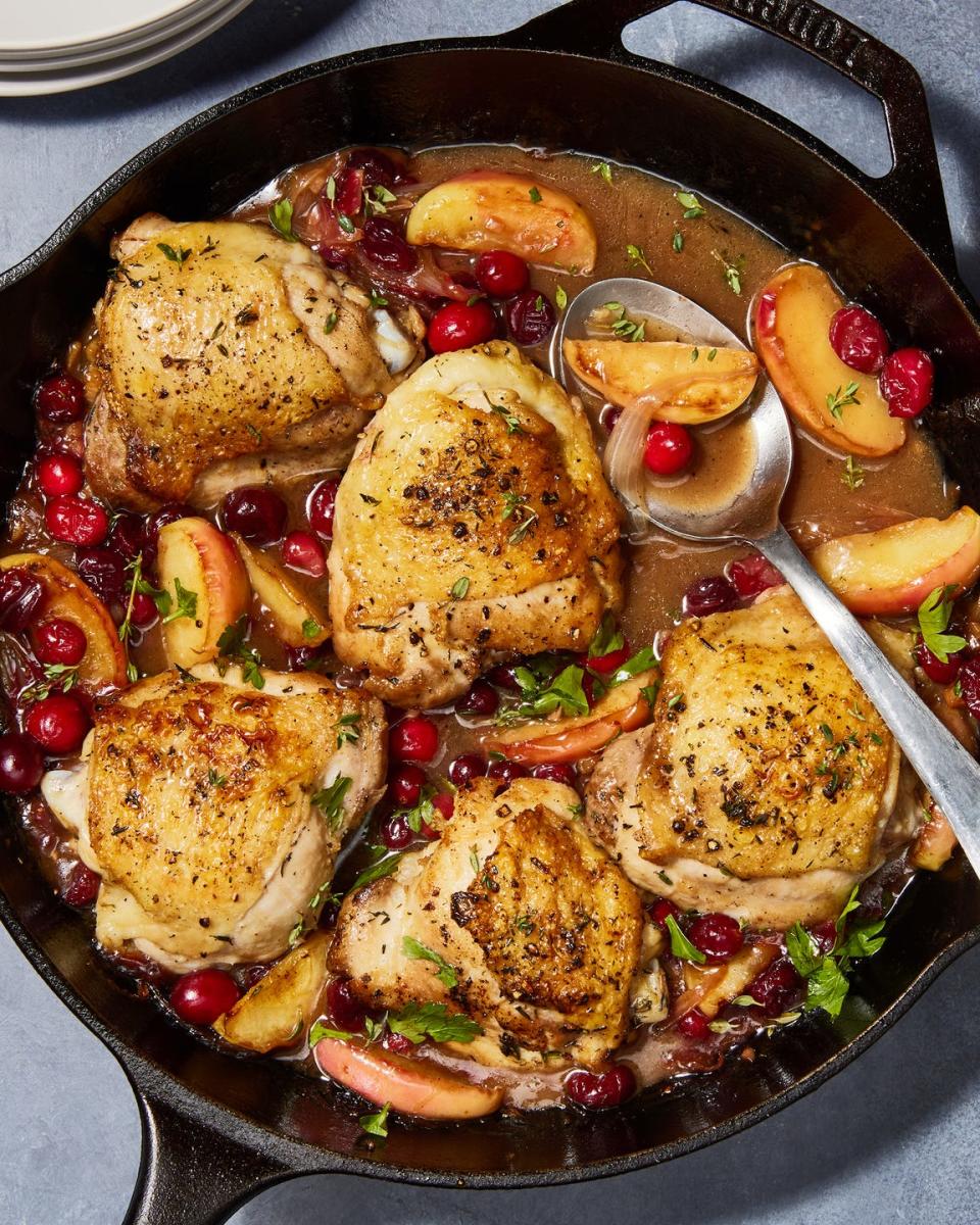 apple cranberry roasted chicken in a skillet