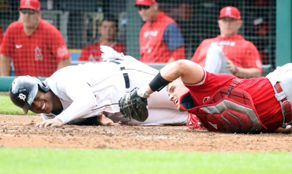 Detroit Tigers second baseman Jonathan Schoop (7) is tagged out by Los Angeles Angels catcher Max Stassi (33) during second-inning action at Comerica Park in Detroit on Saturday, Aug. 20, 2022.