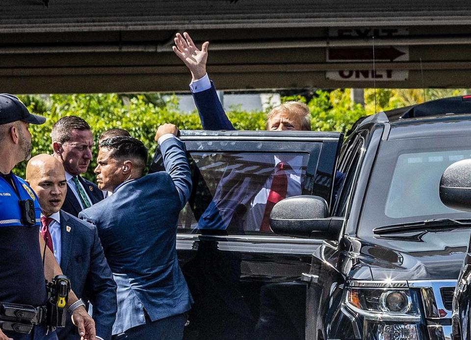 Former President Donald Trump greets supporters outside of his SUV at Versailles. on Tuesday, June 13, 2023.