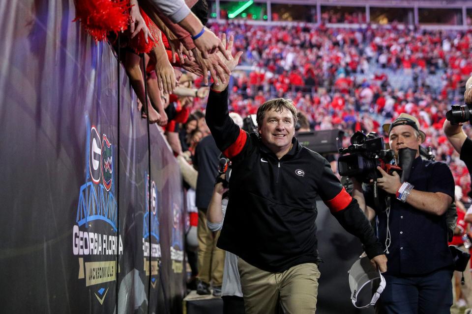 Georgia Bulldogs head coach Kirby Smart celebrates with fans after defeating Florida in the annual Florida vs Georgia football rivalry game at TIAA Bank Filed in Jacksonville, Florida Saturday, November 2, 2019. [James Gilbert/Florida Times-Union] 