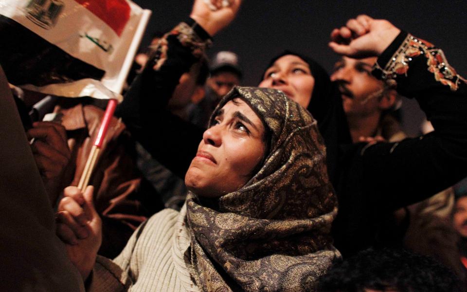An Egyptian woman cries as she celebrates the news of the resignation of President Hosni Mubarak - Tara Todras-Whitehill /AP