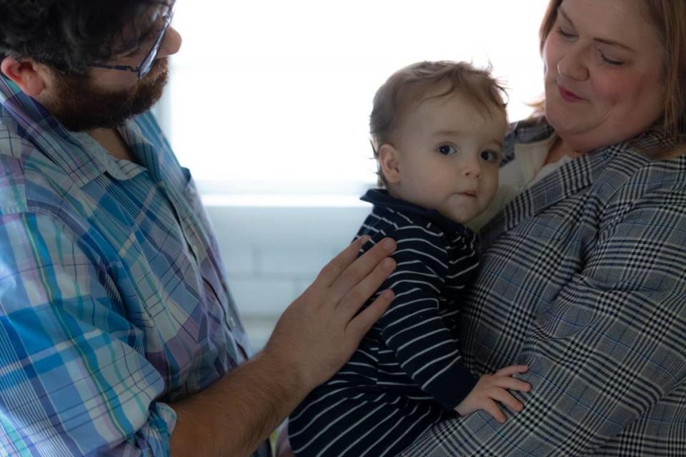 Kentucky State Rep. Lindsey Burke, D – Lexington, is photographed with her son, Ewan Mancillas, and husband, Spencer Mancillas, at their home in Lexington, Ky., on Wednesday, April 10, 2024.