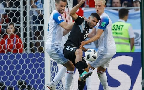 Argentina's Sergio Aguero, centre, vies for the ball with Iceland's Albert Gudmundsson, left, and Hordur Magnusson - Is VAR getting it right in Russia? - Credit: Victor Caivano/AP