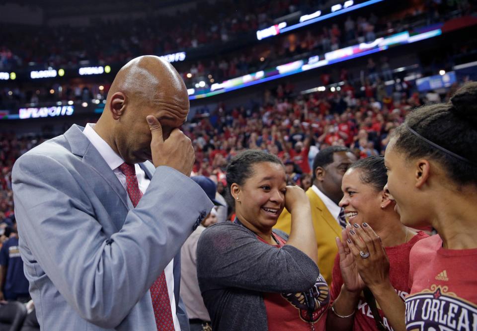 In this April 15, 2015, file photo, New Orleans Pelicans coach Monty Williams reacts after the team's victory in an NBA basketball game against the San Antonio Spurs in New Orleans. Williams' wife, Ingrid Williams, is second from right. Oklahoma City police say Ingrid Williams died on Feb. 10, 2016, at a hospital. Capt. Paco Valderrama says the 44-year-old's SUV was struck Tuesday night just outside downtown Oklahoma City when an oncoming car crossed the center line.