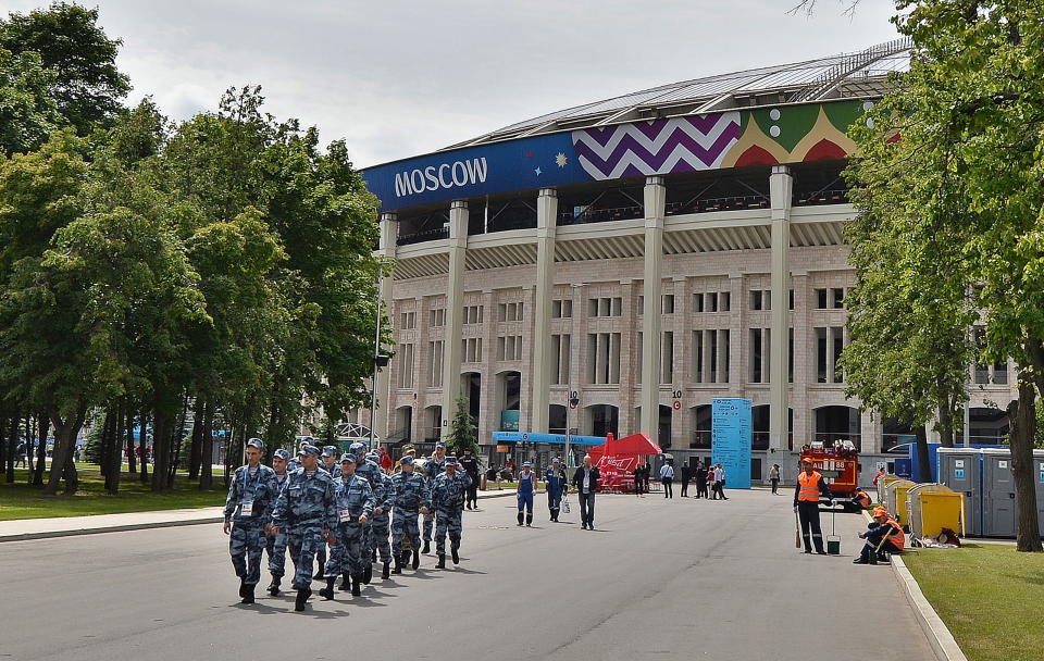 <p>Security presence: A line of police patrol Moscow’s Luzhniki Stadium on Thursday morning. (EPA) </p>